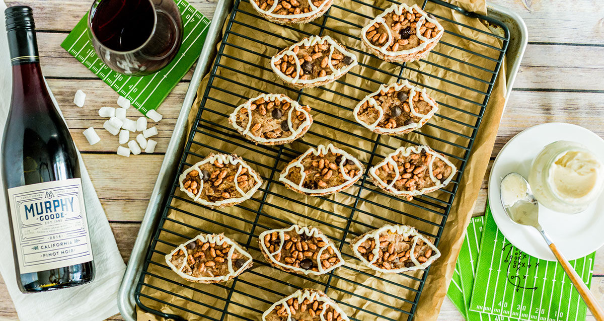 Chocolate Football Rice Krispie Teats with Marshmallow on a cooling rack