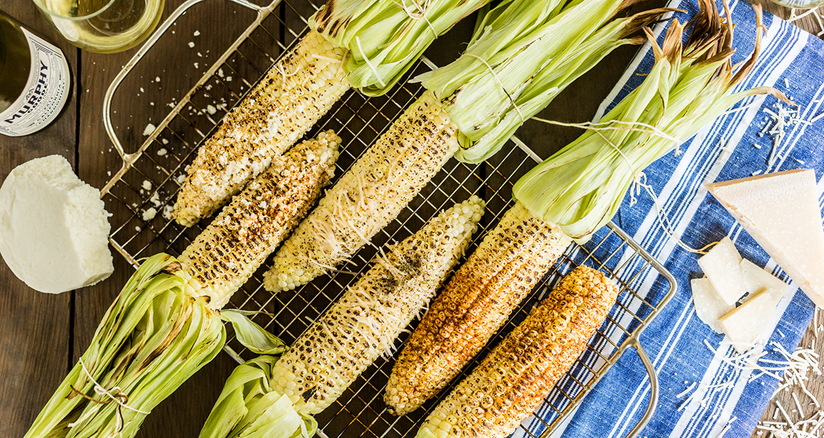 Grilled corn on a roasting pan
