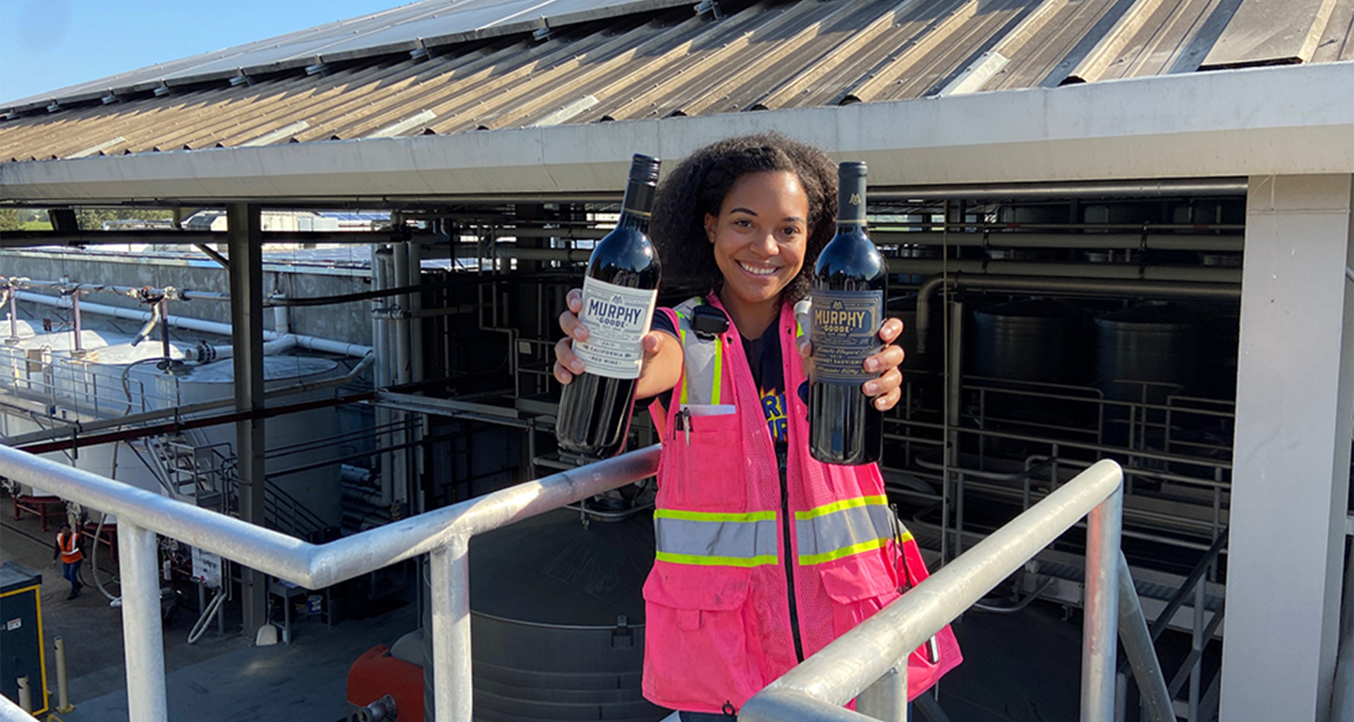 A Really Goode Job Winner Lindsay holding bottles of Murphy-Goode Wine