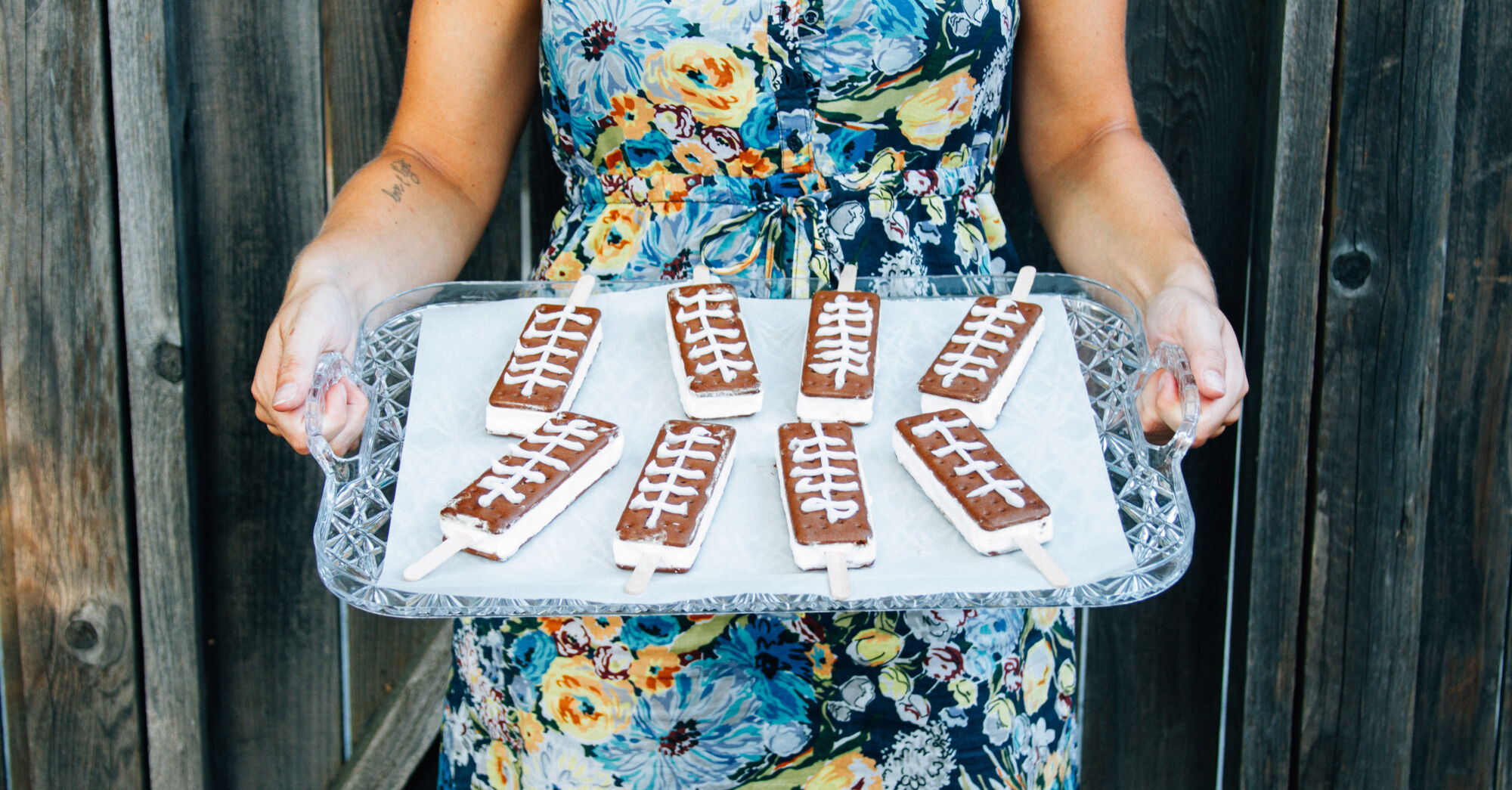 Person holding a tray of ice cream sandwiches 