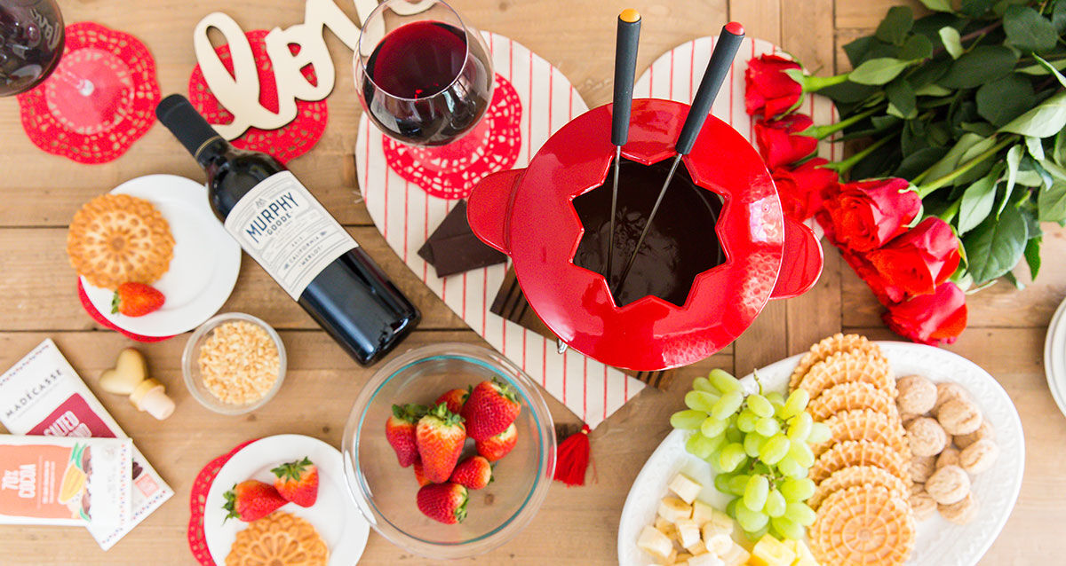 Chocolate Fondue with a bottle of Murphy-Goode Wine Bottle on a Valentine's Themed Table