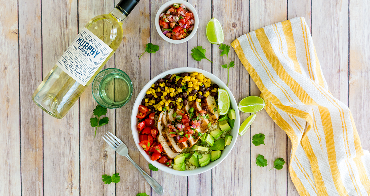 Cauliflower Rice Bowl with Chicken on a table with Murphy-Goode Wine bottle