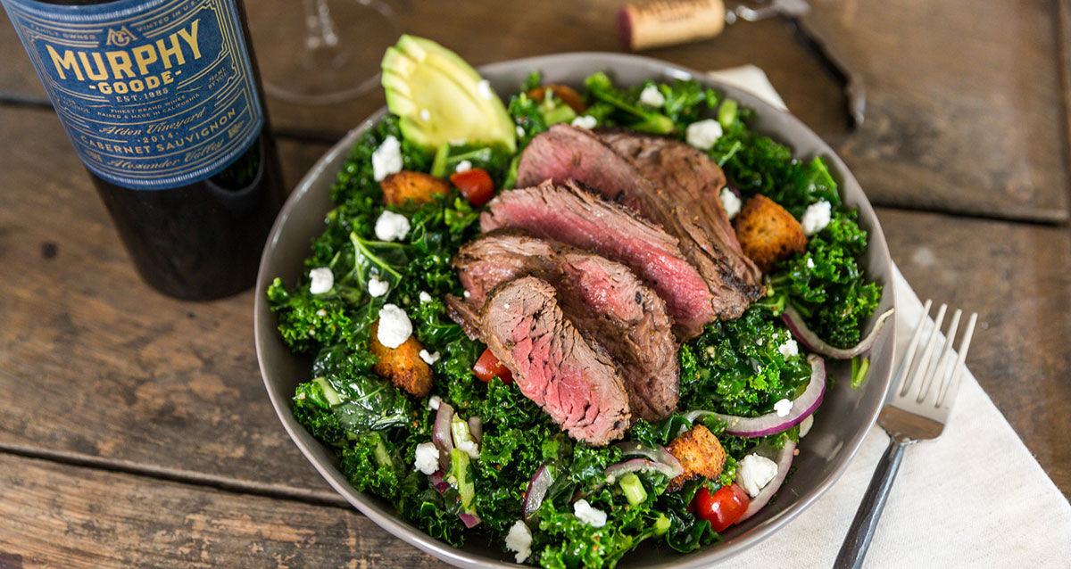 Kale and Steak Bowl  on a table with Murphy-Goode Wine