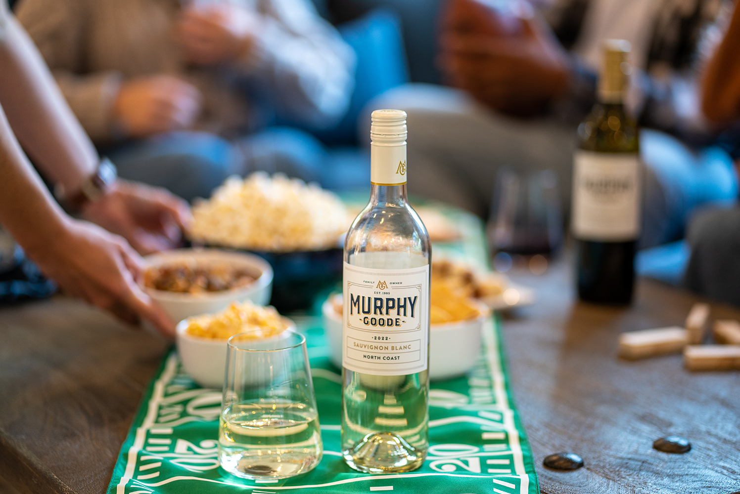 Holiday wine gifts, wrapped packages of wine on doorstep, Chardonnay, Pinot Noir, and Cabernet Sauvignon