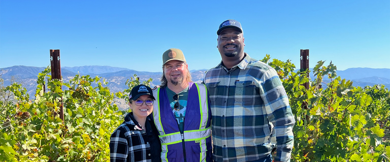 Meet The 2022 A Really Goode Job Winners, Lauren Neil and Roosevelt Johnson, standing with Murphy Goode Winemaker Dave Ready Junior.